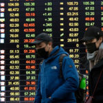 Asian markets surge as central banks signal support