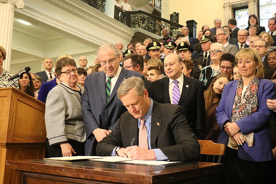 Group Of Former Leaders Signing A Document